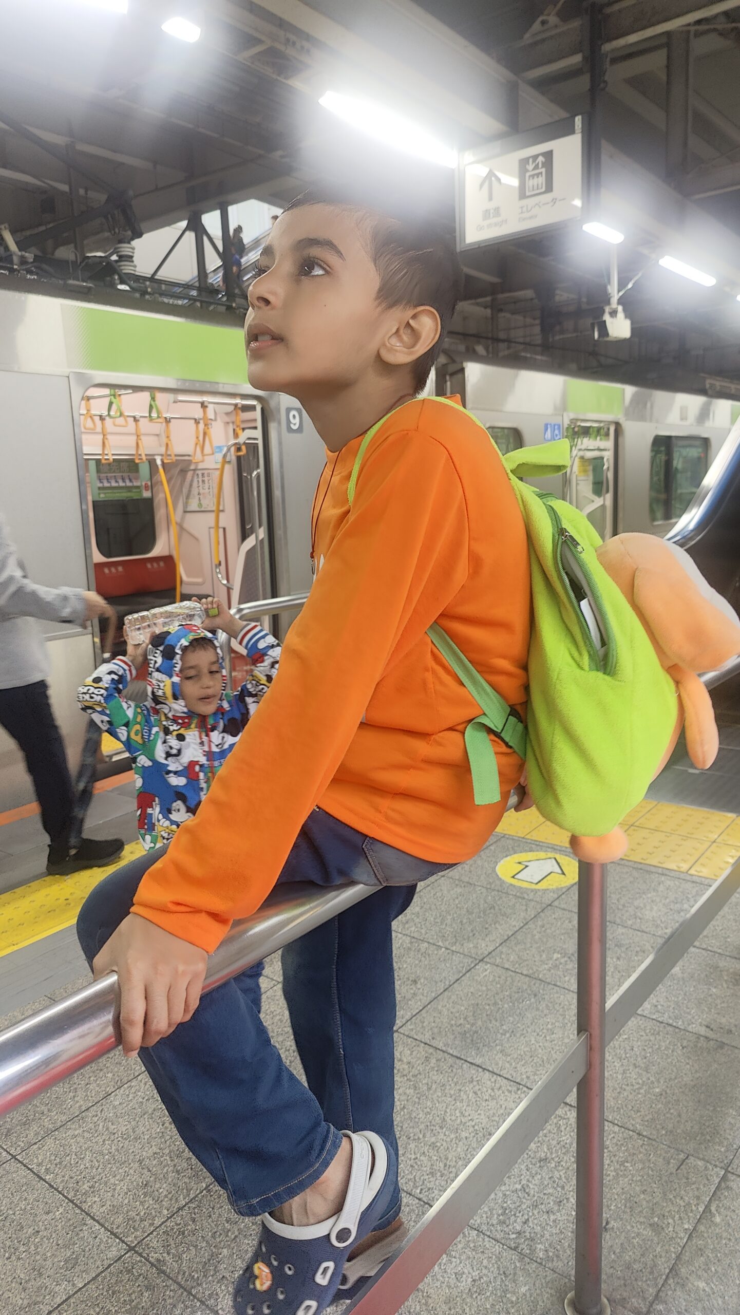 Vihaan at a train station platform during an adventure outing