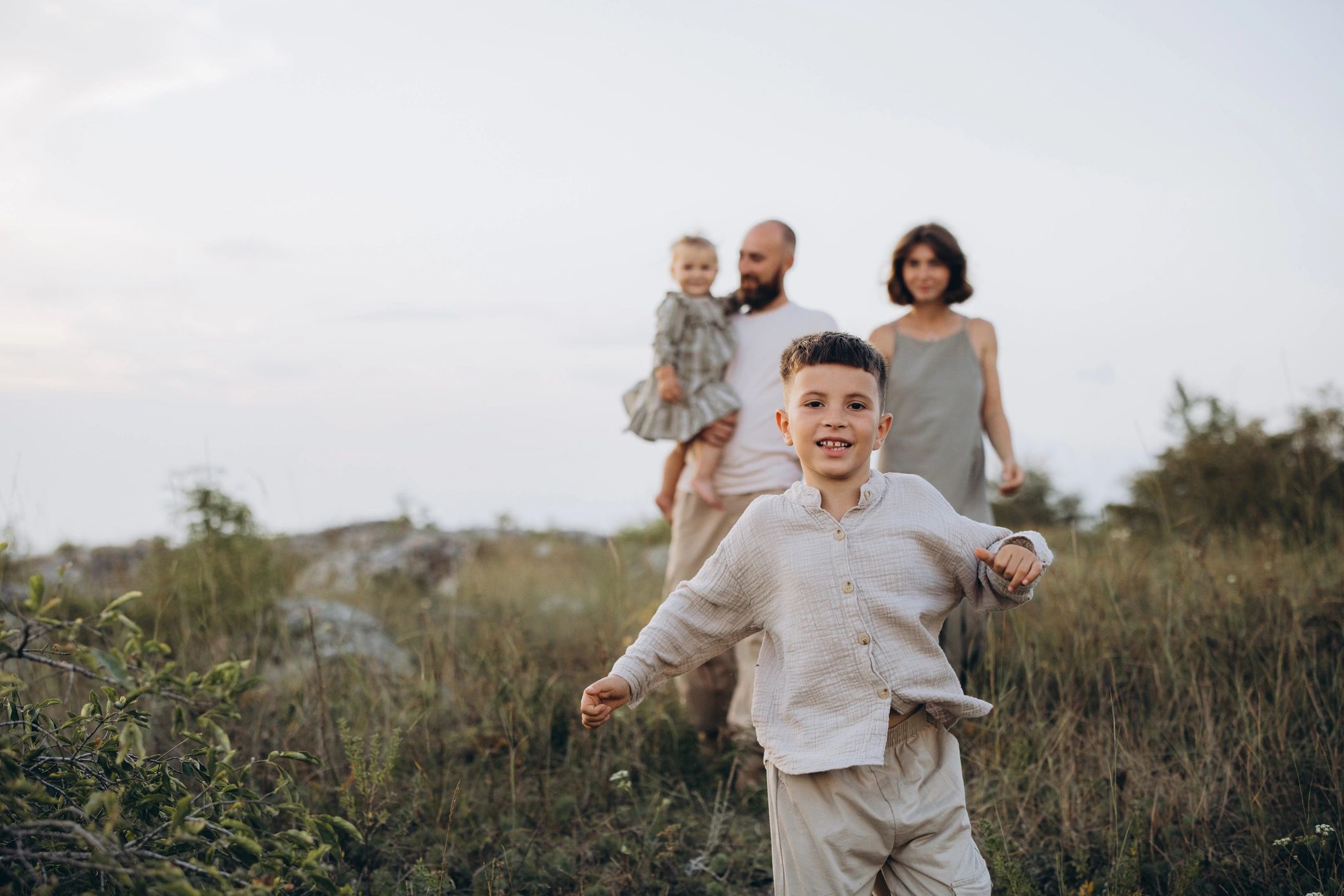 Family walking together in nature on a sunny day